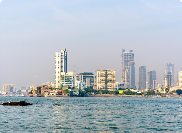 A city skyline featuring tall buildings against a clear sky, showcasing urban architecture and modern design